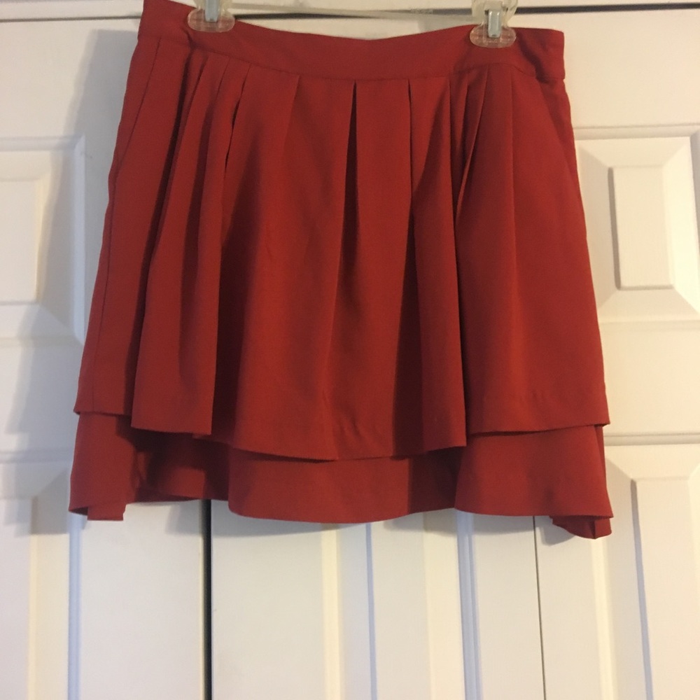Red pleated skirt